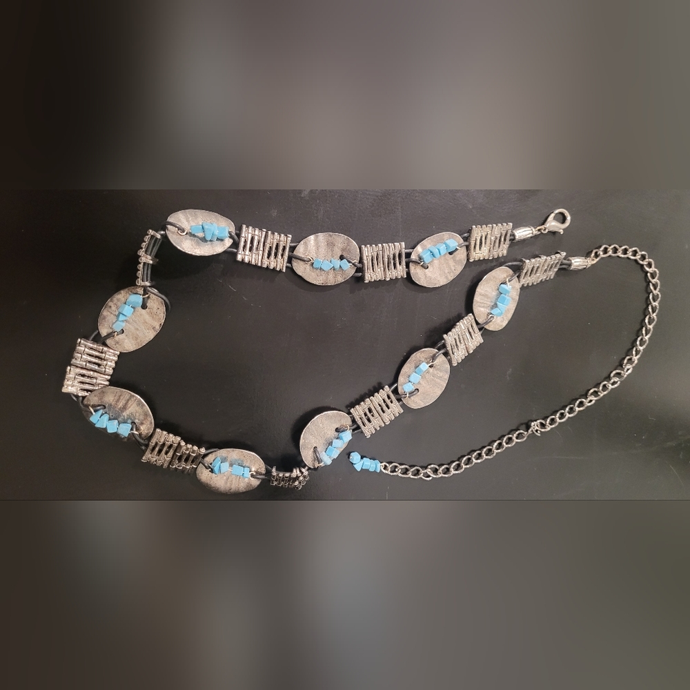 Blue and silver belt. 26 inches with a 13 inch extension